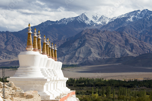 Buddhist stupa and Himalayas mountains. Shey Palace, India