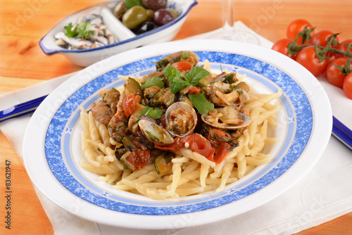 Trofie pasta with shellfish mollusks and fish 