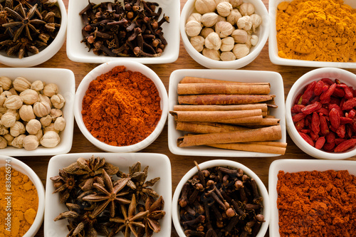 Fototapeta Naklejka Na Ścianę i Meble -  Wooden table of colorful spices