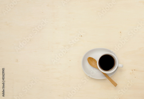 White coffee cup on white wood background