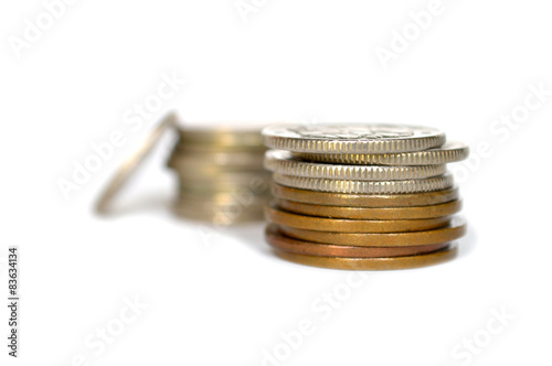 Silver and golden coins on white background