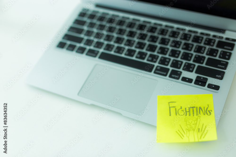 Laptop with adhesive note Laptop with adhesive note