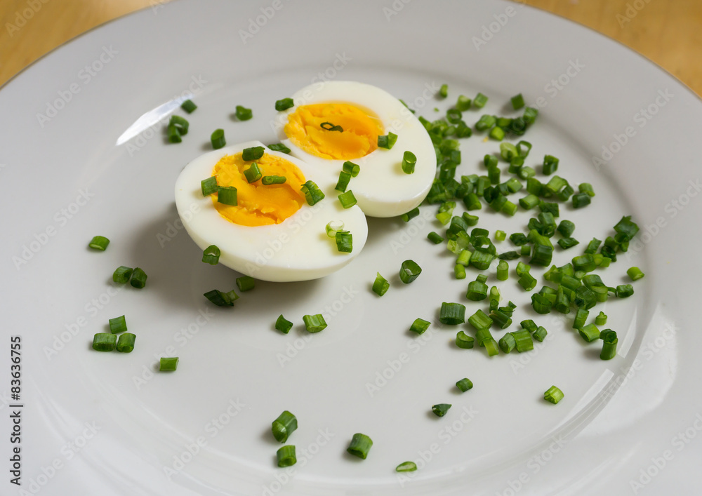 Boiled egg halves on a white plate