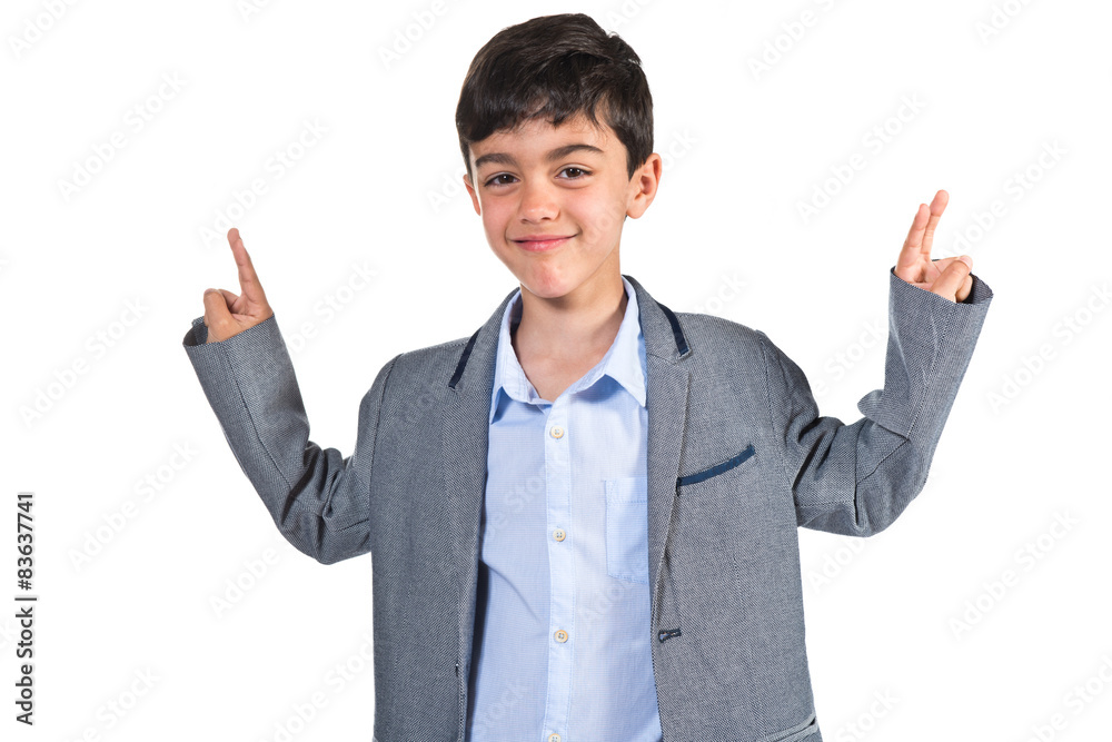 Child doing victory gesture Child doing victory gesture
