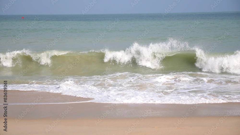 White Sand Beach and the Sea with Foam Waves. White Sand Beach and the Sea with Foam Waves.