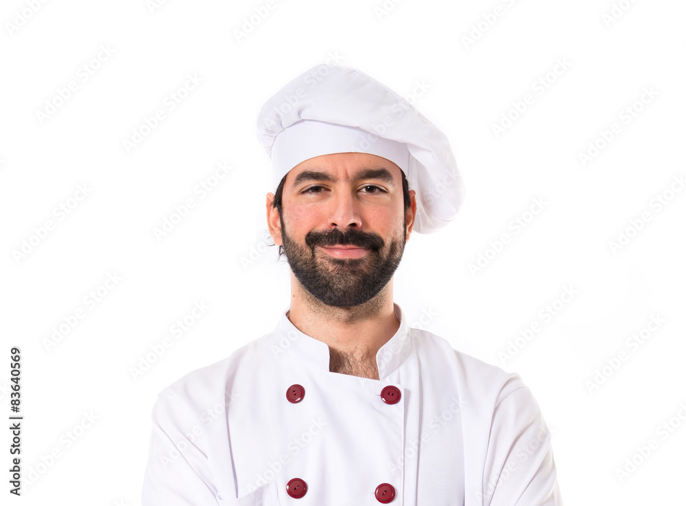 Chef with his arms crossed over white background