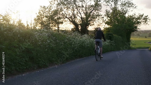 Wallpaper Mural man relaxing on the bike wearing glasses Torontodigital.ca