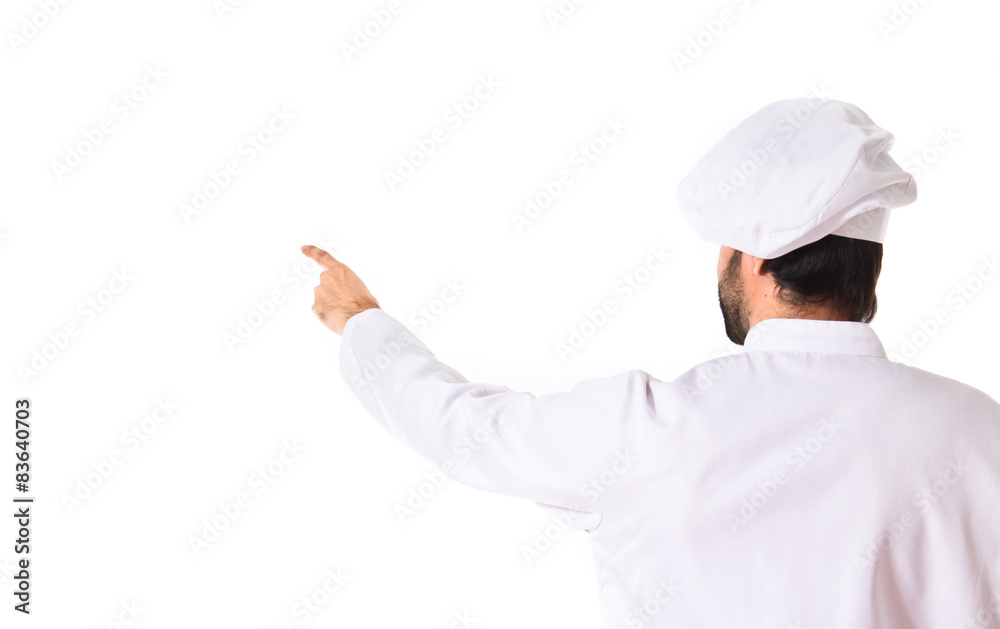 Chef pointing back over white background Chef pointing back over white background