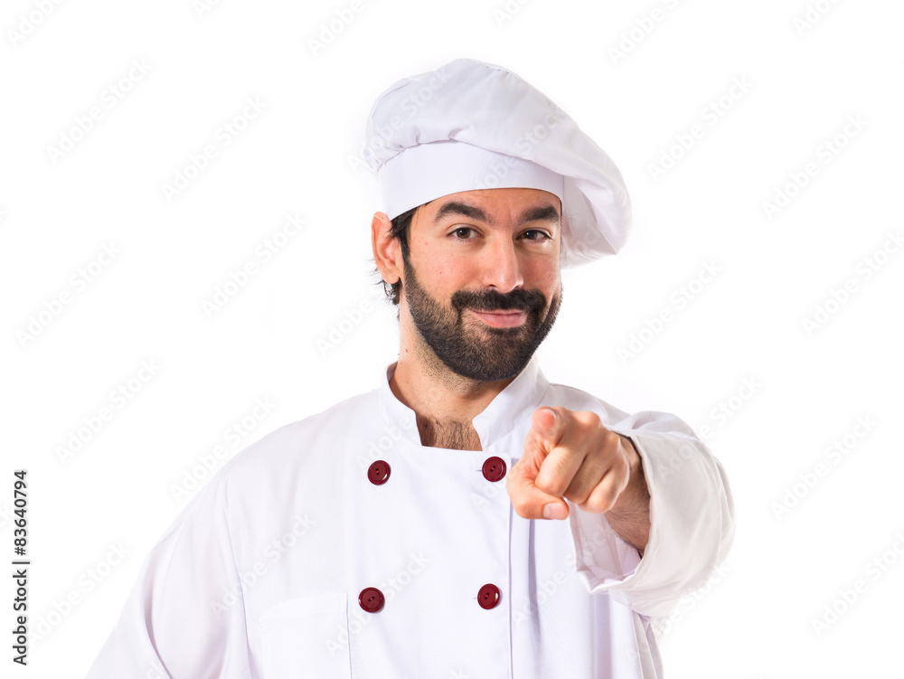 Chef pointing to the front over white background Chef pointing to the front over white background