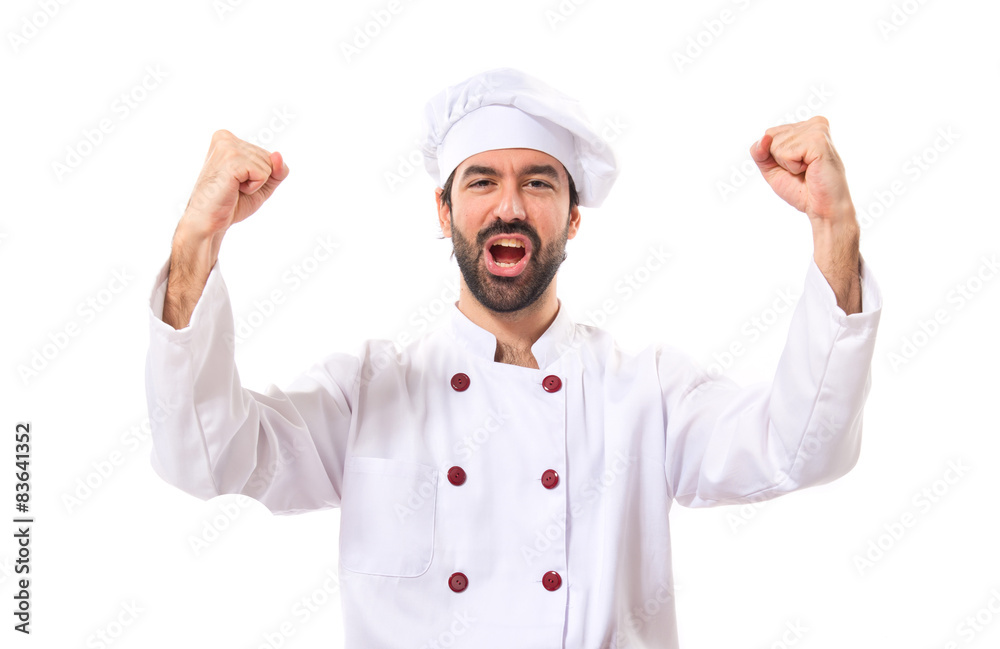 Lucky chef over isolated white background Lucky chef over isolated white background
