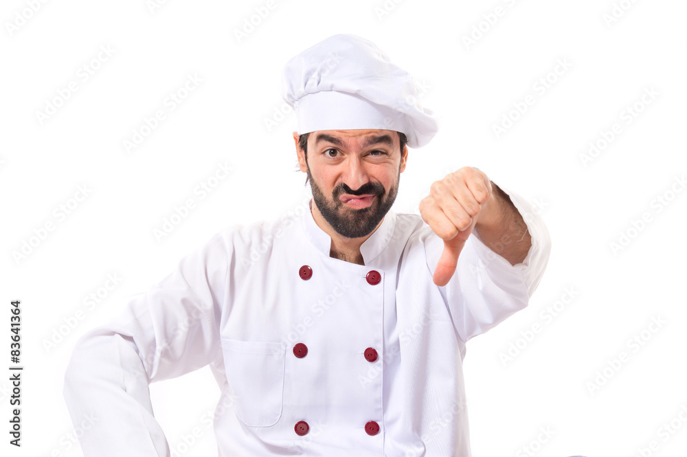Chef doing a bad signal over white background Chef doing a bad signal over white background