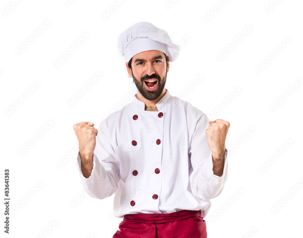 Lucky chef over isolated white background Lucky chef over isolated white background