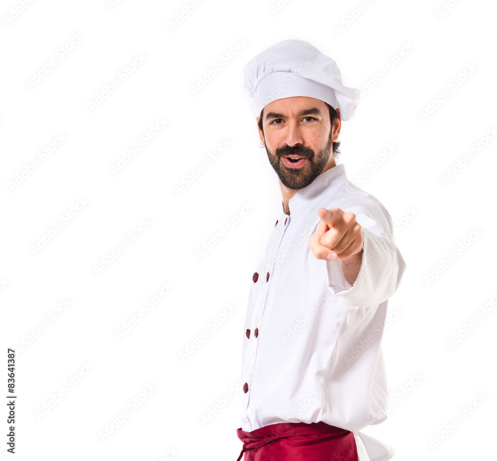 Chef pointing to the front over white background Chef pointing to the front over white background