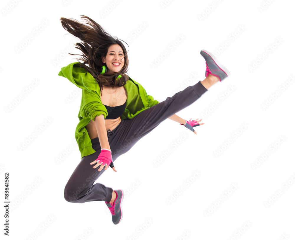 Teenager girl jumping in street dance style