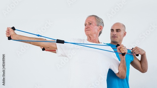 Old man stretching elastic  photo