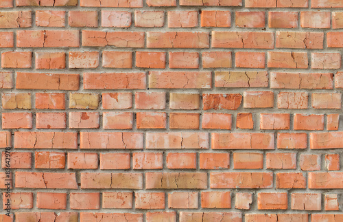 Red weathered brick wall seamless pattern