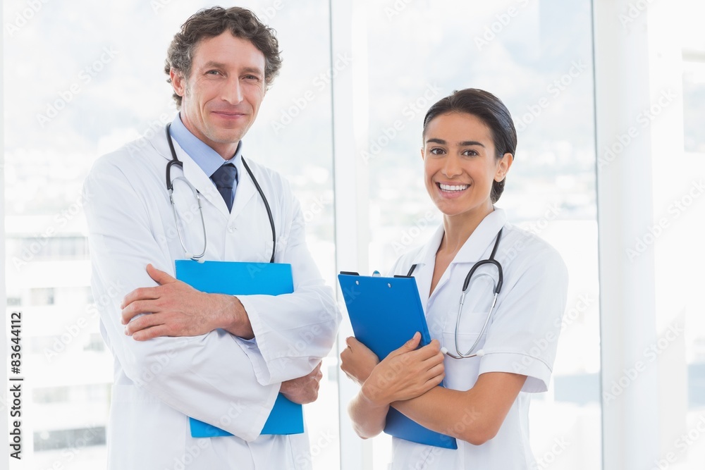 Happy doctors looking at camera Happy doctors looking at camera