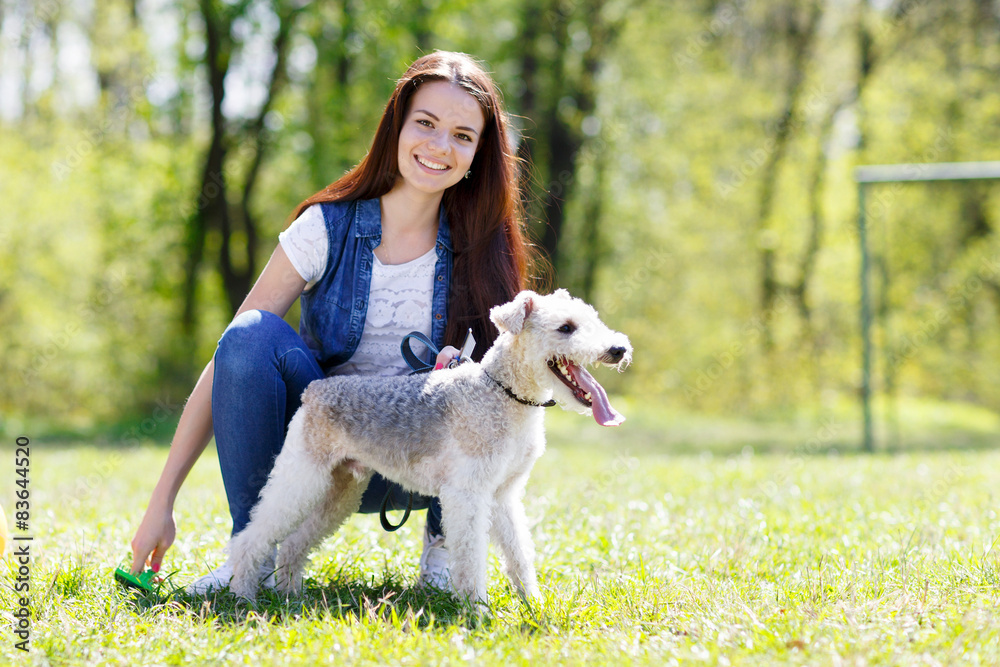 portrait of Beautiful young girl with her dogs  