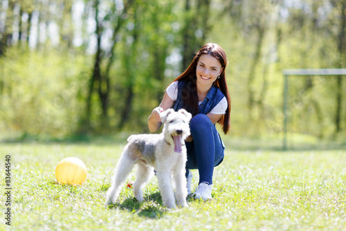 portrait of Beautiful young girl with her dogs 