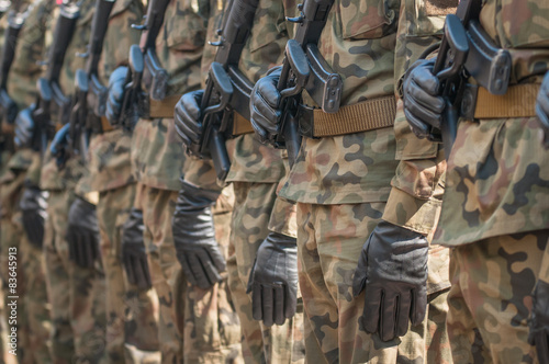 Army parade - armed soldiers in camouflage military uniform