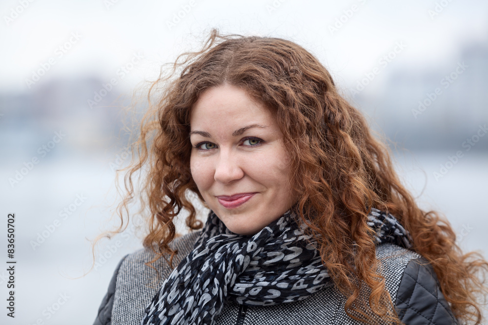 Pretty woman with long curly hair, head and shoulders portrait Pretty woman with long curly hair, head and shoulders portrait