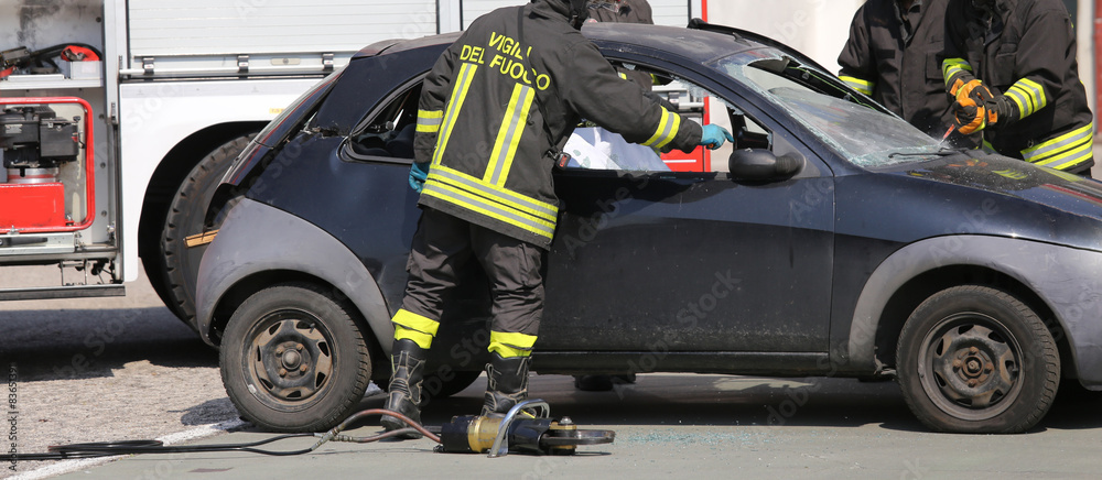 Firefighters freed the wounded by car accident sheet Firefighters freed the wounded by car accident sheet