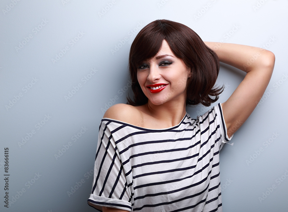 Smiling happy young woman in casual dress relaxing Smiling happy young woman in casual dress relaxing