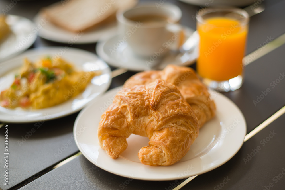Croissant Breakfast served with black coffee and breakfast menu. Croissant Breakfast served with black coffee and breakfast menu.