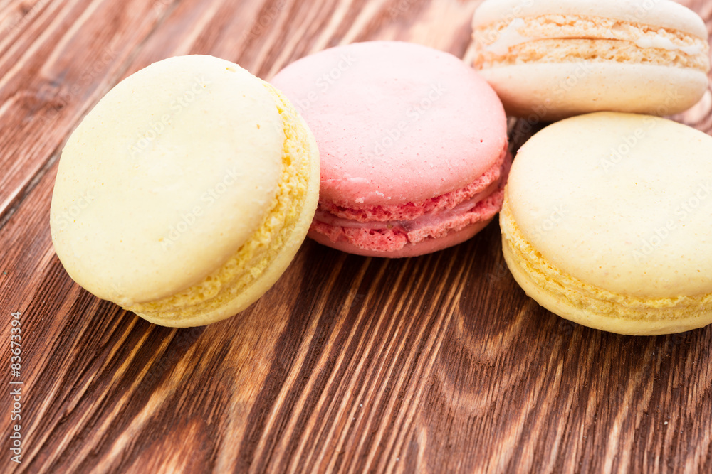 A lot of french colorful cookies on wooden A lot of french colorful cookies on wooden