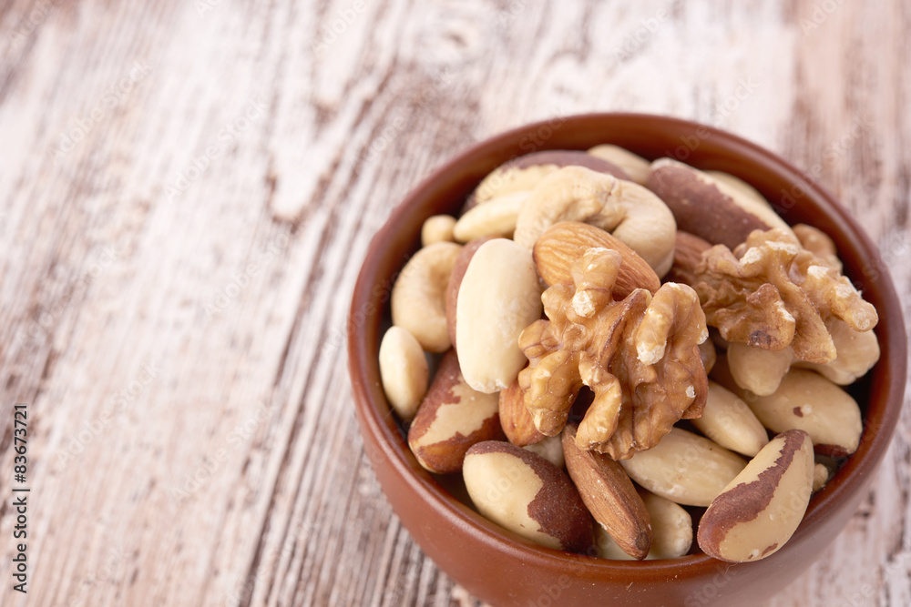 Mix nuts on wooden background Mix nuts on wooden background