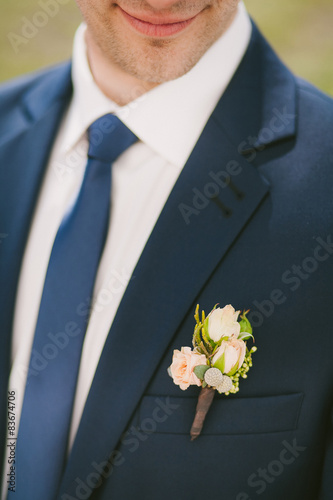 wedding corsage on suit of man