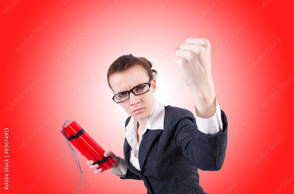 Businesswoman with dynamite on white