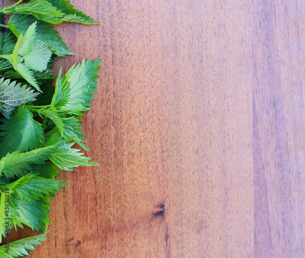 nettle on a wooden background nettle on a wooden background