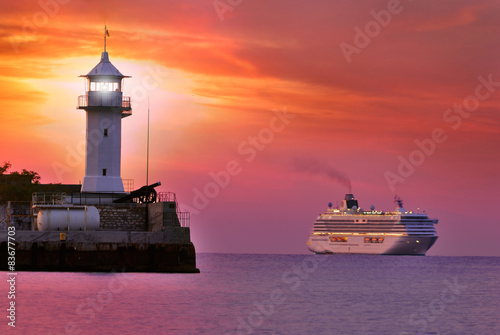Wallpaper Mural lighthouse in red twilight with ship Torontodigital.ca