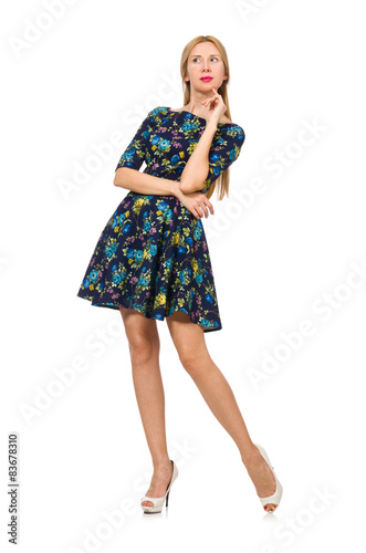 Woman in dark blue floral dress isolated on white