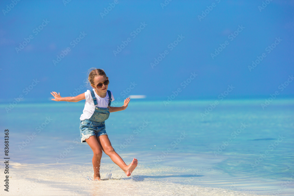 Cute happy little girl have fun on beach vacation Cute happy little girl have fun on beach vacation