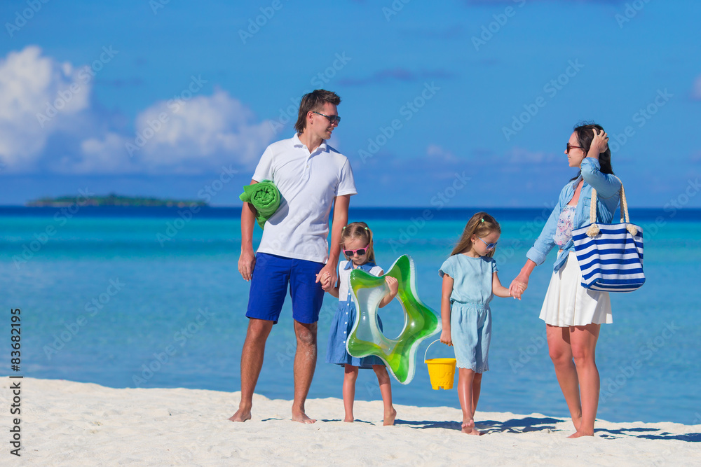 Happy family during summer vacation on white beach Happy family during summer vacation on white beach
