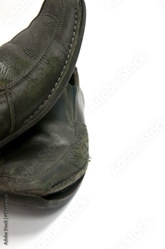 Closeup of Old pair of black male shoes