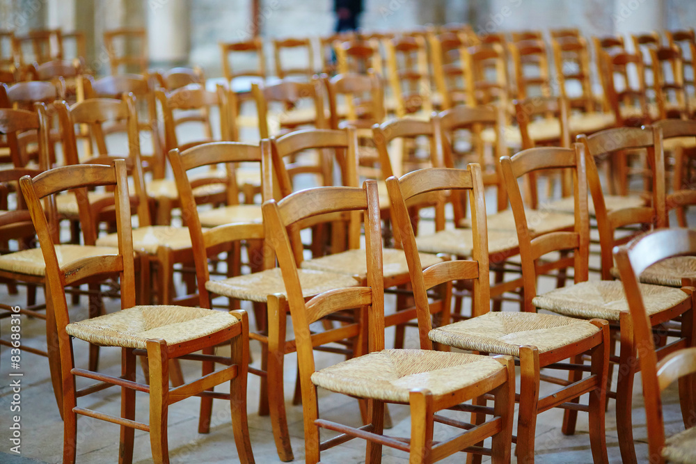 Many wooden chairs in church