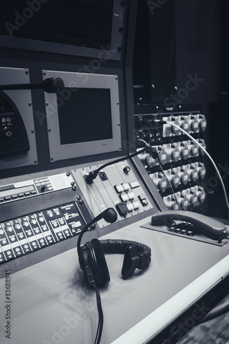Music mixer control desk and headphone in Studio