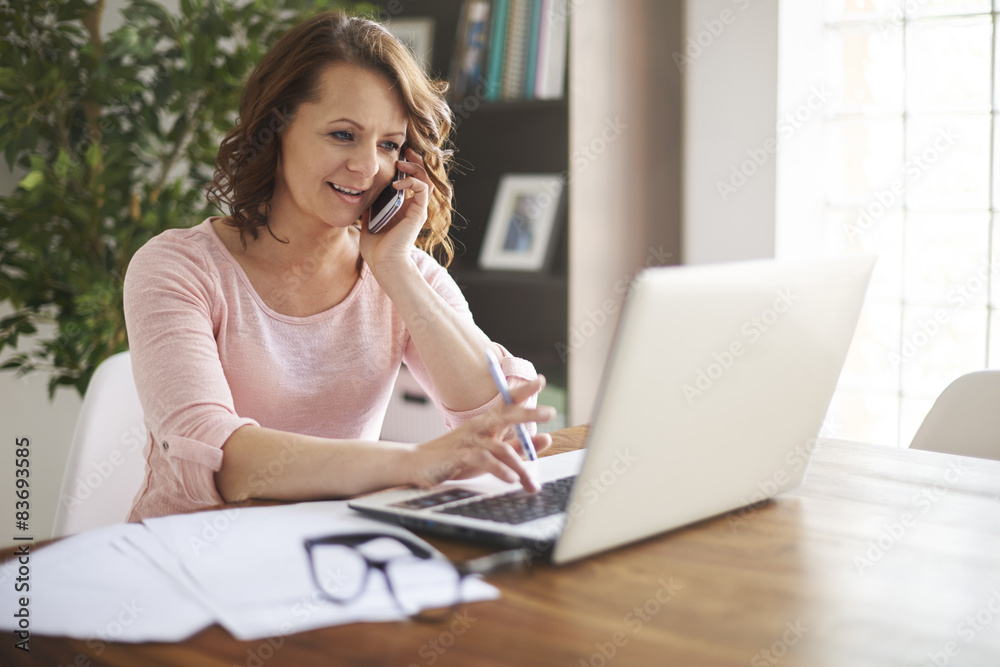Busy businesswoman working at home office Busy businesswoman working at home office