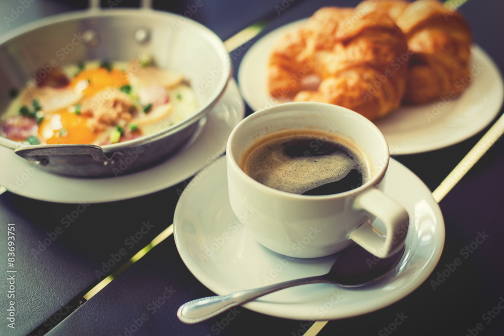Croissant Breakfast served with black coffee and breakfast menu. Croissant Breakfast served with black coffee and breakfast menu.