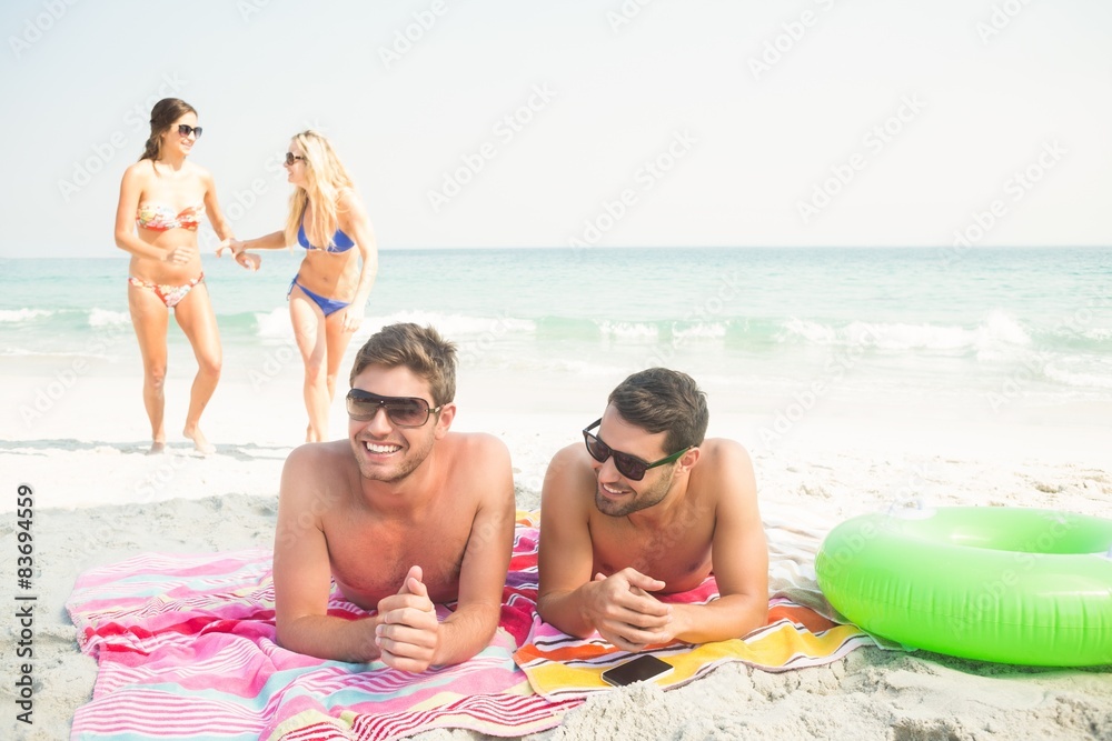 group of friends in swimsuits 