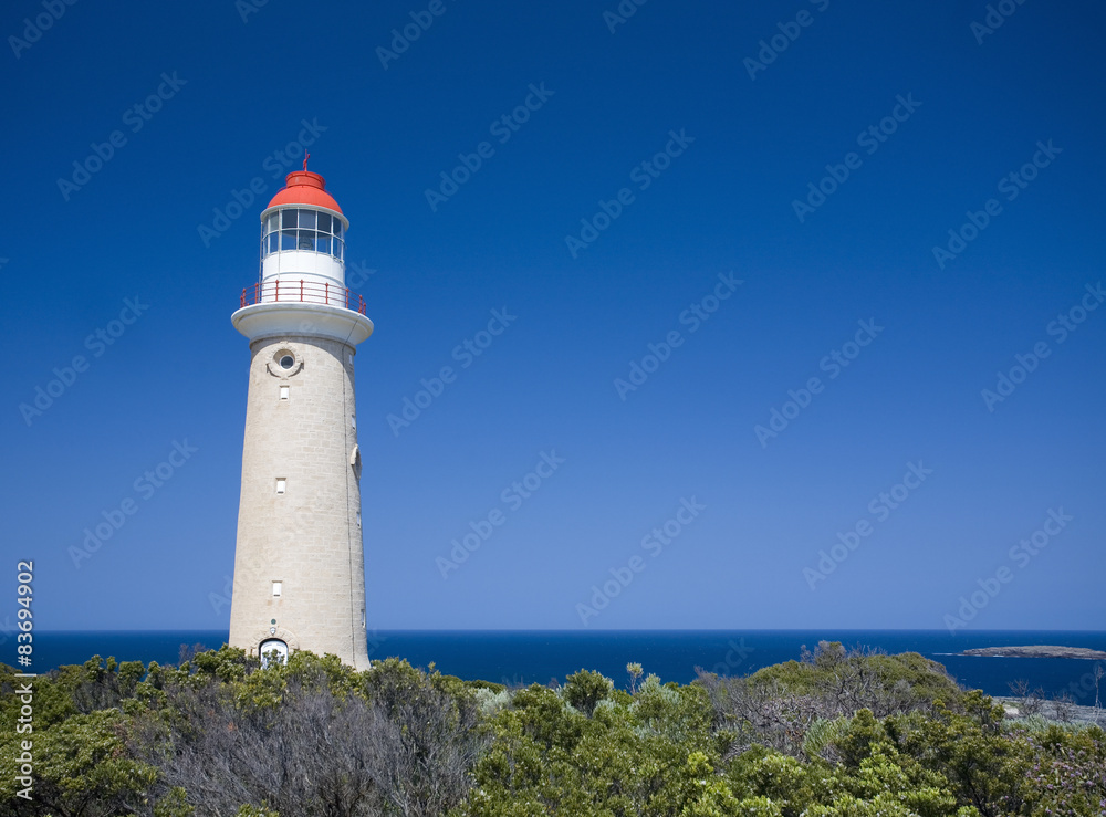 Lighthouse against clear blue sky