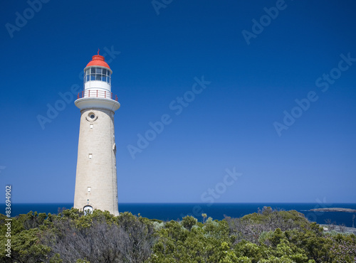 Lighthouse against clear blue sky