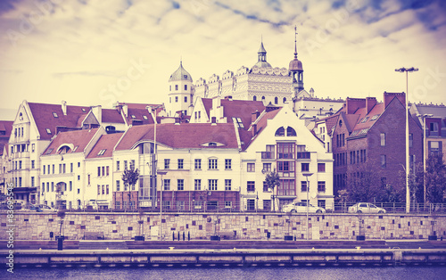 Vintage toned picture of Szczecin waterfront and castle, Poland.