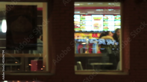 Windows of a fast food restaurant in the evening
 photo
