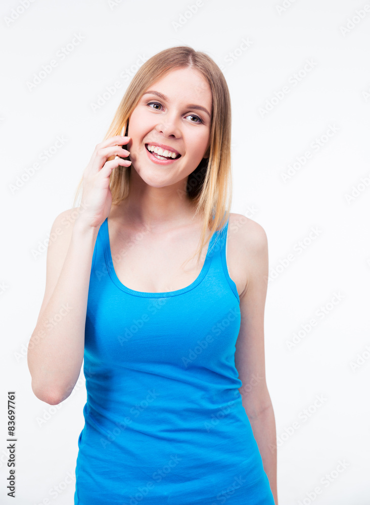 Smiling young woman talking on the phone Smiling young woman talking on the phone