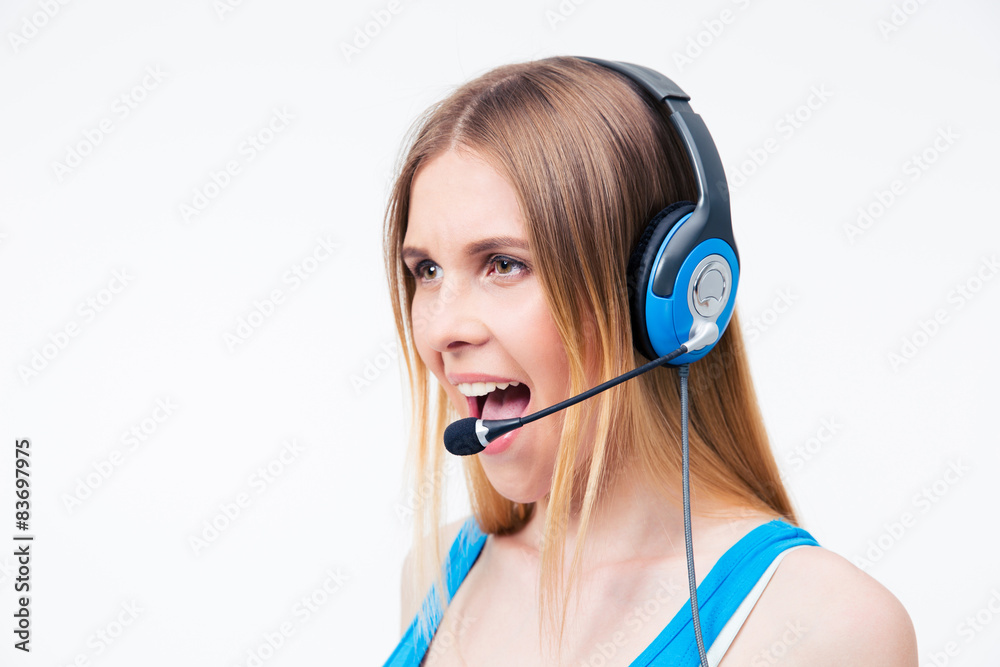 Young woman assistant operator shouting in headset Young woman assistant operator shouting in headset