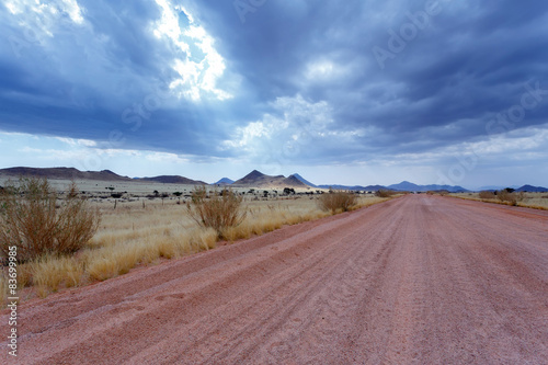 endless road in Namibia moonscape landscape photo